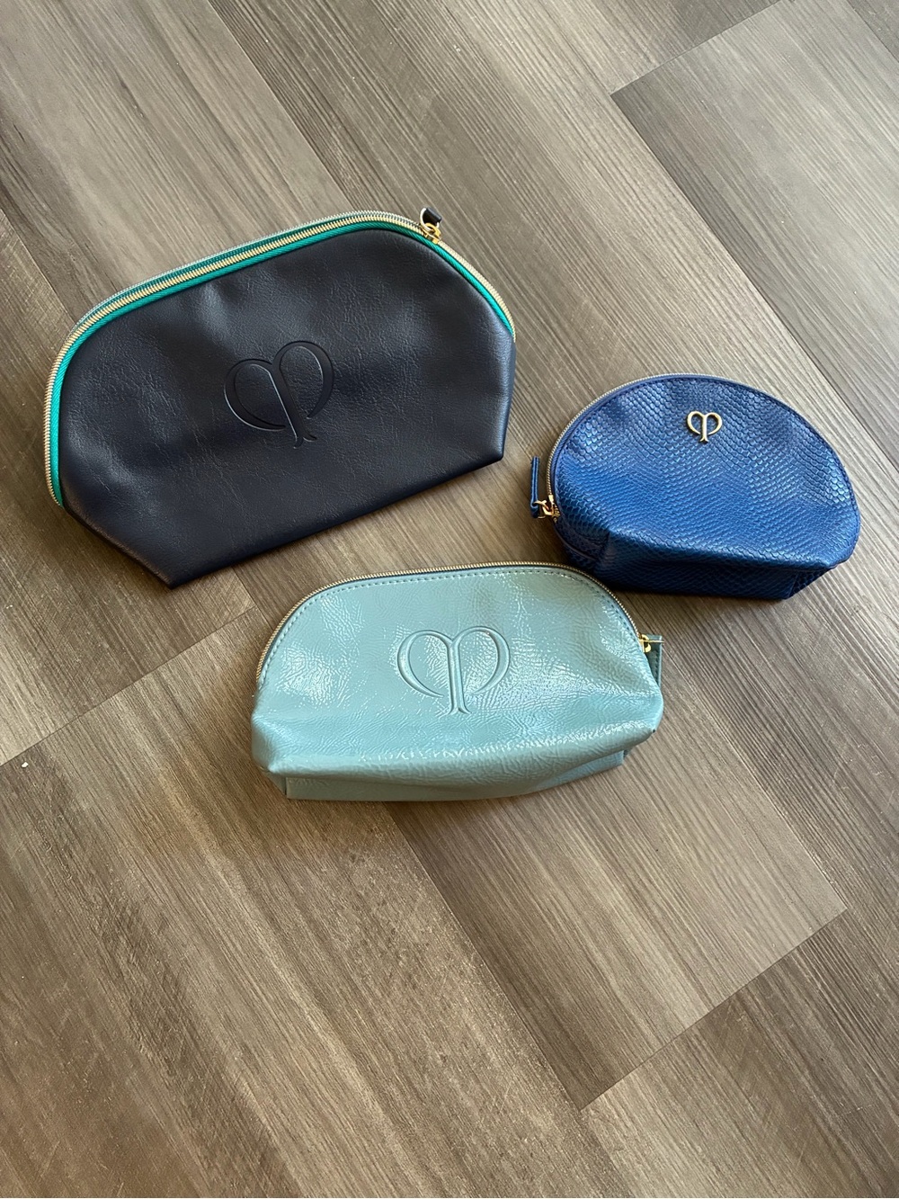 Cle de peau beaute Three-Piece Cosmetic Pouch Set – Black, Navy, Mint